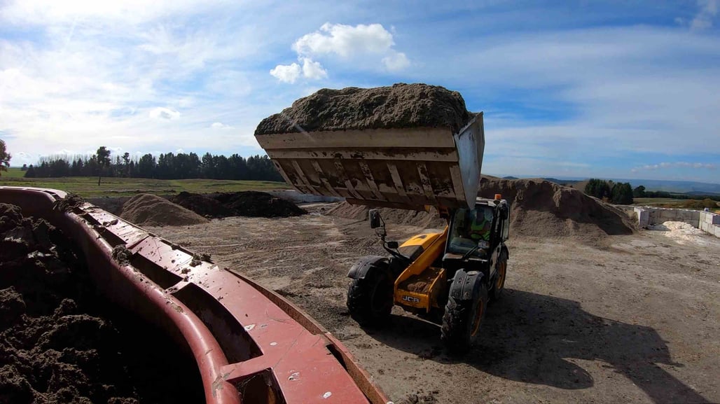A MyNoke bulldozer moves bulk vermicast at the world's biggest worm farm